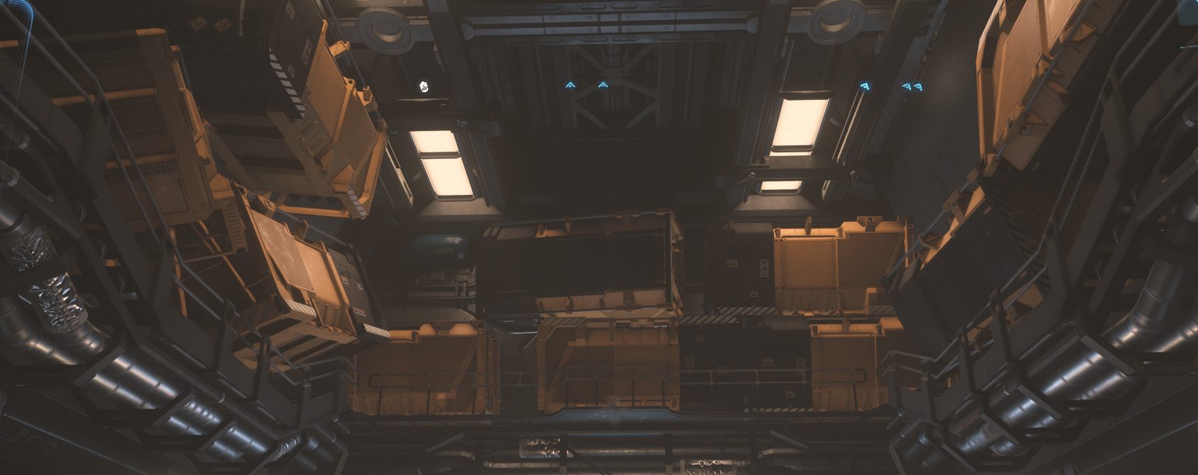 La soute d'un vaisseau de récupération chargée de caisses empilées sur plusieurs niveaux, sous des plafonniers, dans Star Citizen